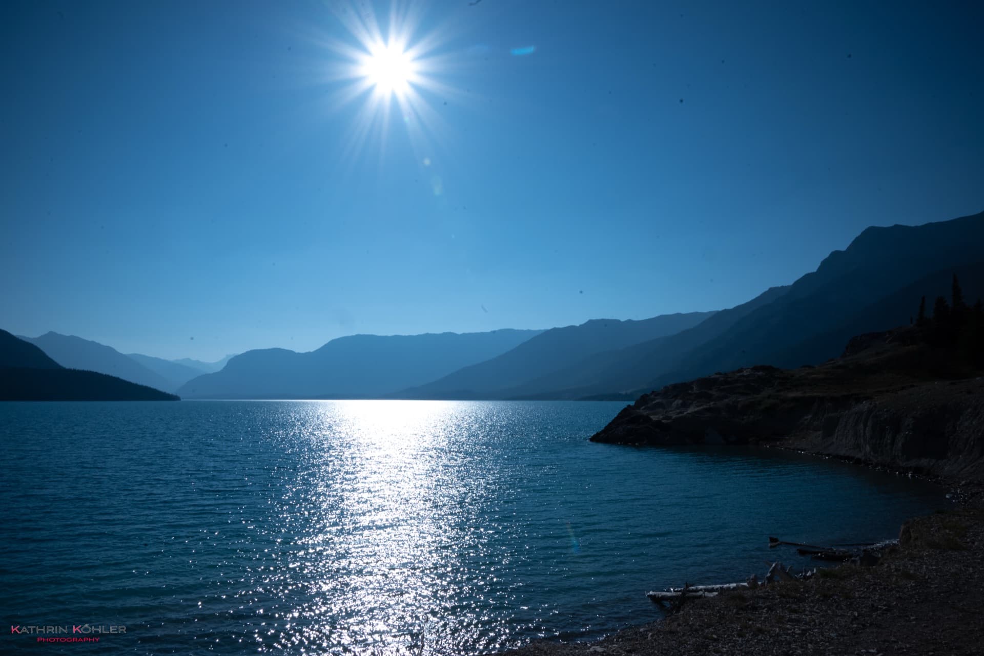 Landschaft — See mit Sonnenstern